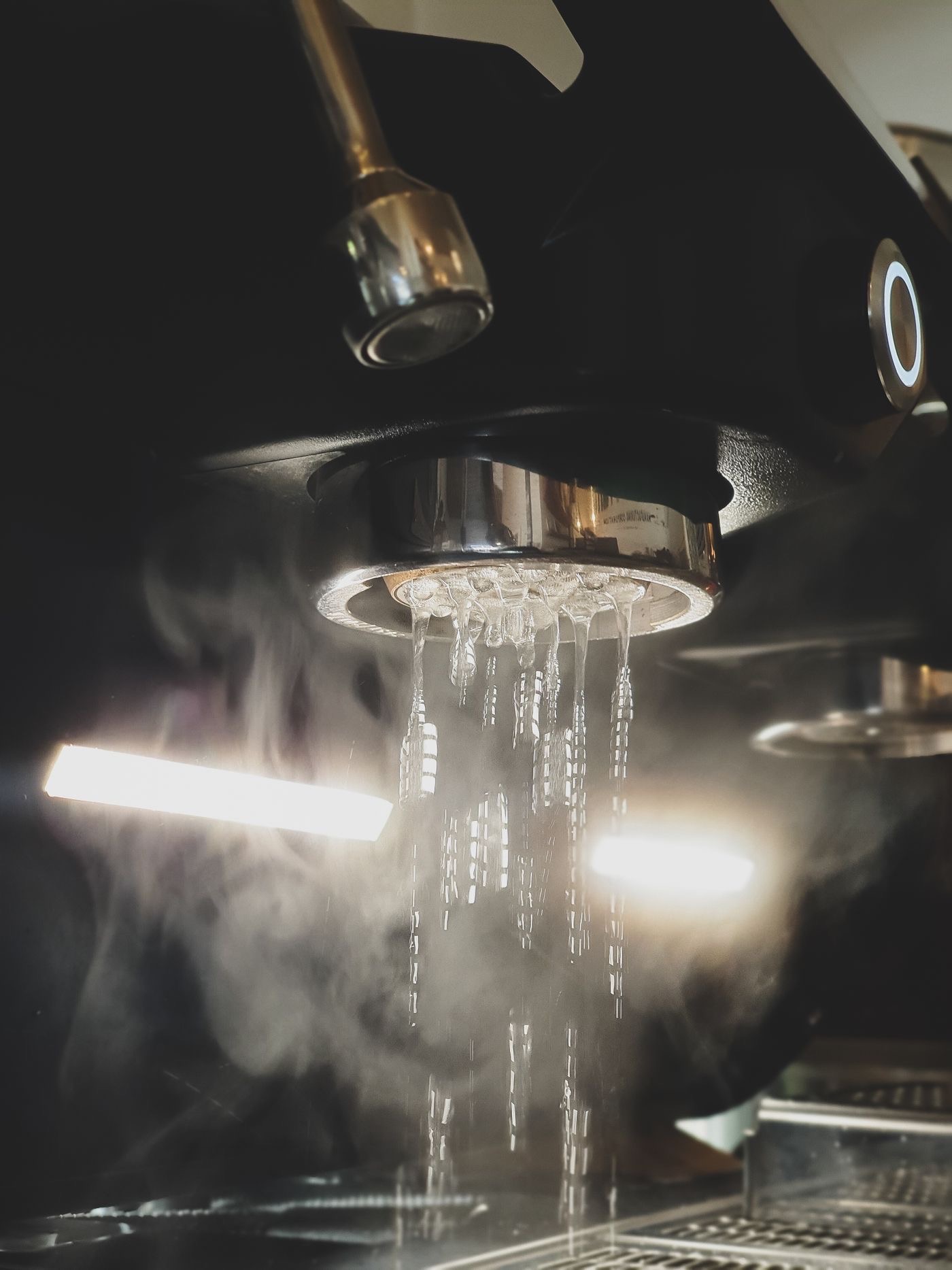 Hot water flushing from an espresso machine group head