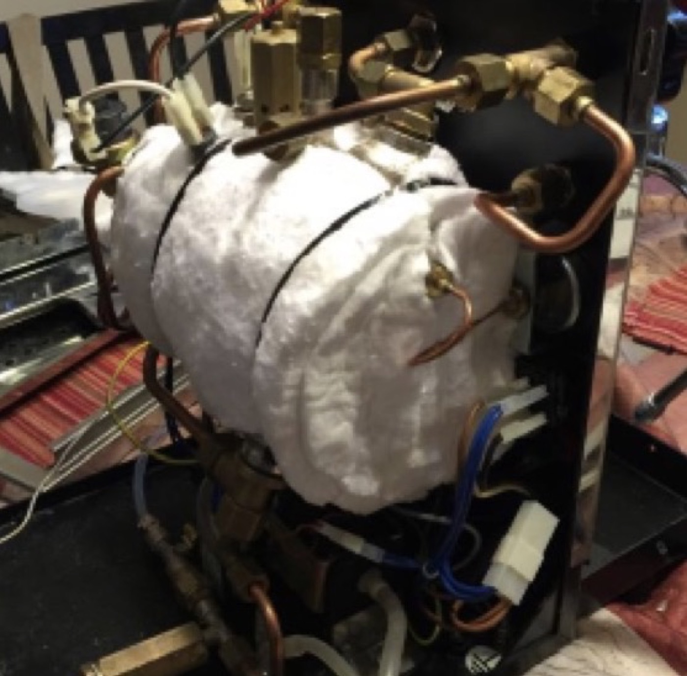 Espresso machine boiler wrapped in mineral wool insulation